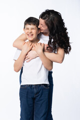mother with son in jeans and white t-shirts on a white background. motherhood concept