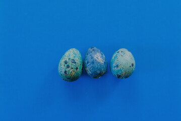 Blue Easter eggs on a blue background. Concept