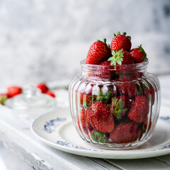 fresh strawberries in a glass container