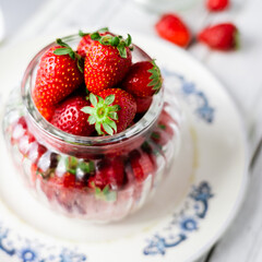 fresh strawberries in a glass container