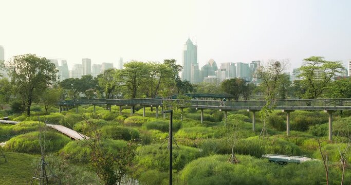The Benchakitti Park in Bangkok Thailand, public green park after a recent extension with extra greenery, water features and walkways built.