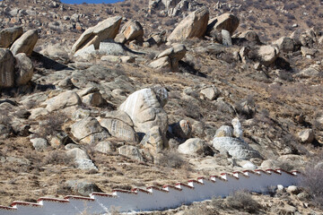 Wall running down the mountainside at Sera Monastery Lhasa Tibet