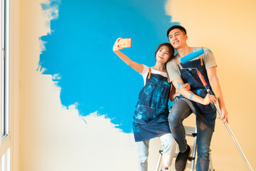 couple painting wall