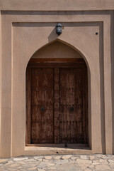 old door in Ibri Castle in Oman, historic building 