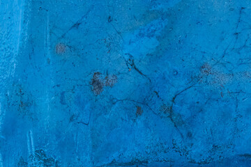 Old concrete wall worn cement background with abstract paint blue rough texture