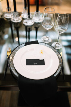 Festive luxury black table setting with flowers. Wedding concept 
