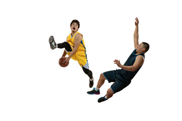 Two young professional basketball players in action, motion isolated on white studio background. Active lifestyle, sport, tournament concepts.