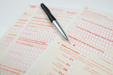 Obraz premium Australian tax forms and pen.
