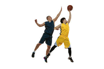 Fototapeta na wymiar Dynamic portrait of two young basketball players jumping with ball isolated on white studio background. Motion, activity, sport concepts.