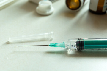 Closeup of a syringe with a needle on the countertop