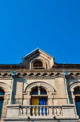 Fototapeta na wymiar Ukrainian flags on the buildings and windows of Tbilisi