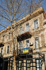 Ukrainian flags on the buildings and windows of Tbilisi