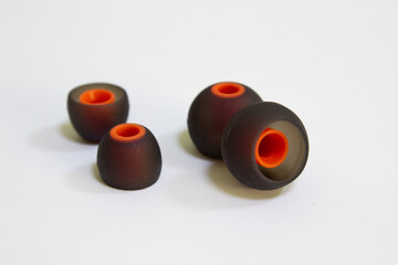 Two sets of ear puds of different size. Modern silicone caps for headphones