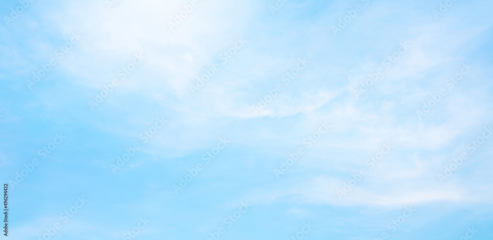 Wall mural abstract white puffy clouds and blue sky background.