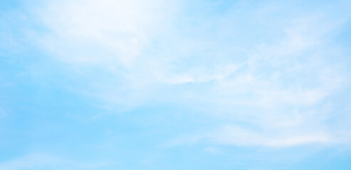 Abstract white puffy clouds and blue sky background.