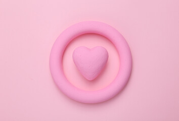 Pink ring with heart on pink background. Minimal still life. flat lay. Love concept. Mock up