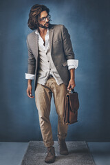 Im here to make show-stopping first impressions. Studio shot of a handsome young man posing against a grey background.