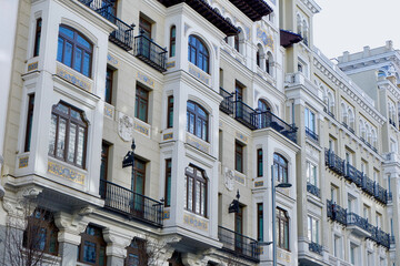 Elegant rich facades from outside on Gran Via avenue in Madrid, Spain