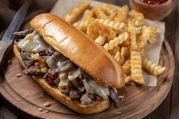 Philly cheesesteak sandwich and french fries - 496296660
