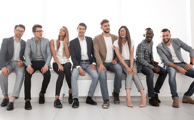 Obraz premium young people are waiting for an interview, sitting in the office lobby