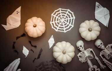 Halloween handmade decor, skeletons and pumpkins. Flat lay. Top view