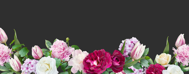Floral banner, header with copy space. White and red roses, peony, tulips isolated on dark grey background. Natural flowers wallpaper or greeting card.