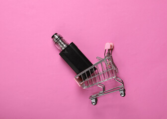 Shopping trolley with vaping device (electronic hookah or cigarette) on pink background. Top view