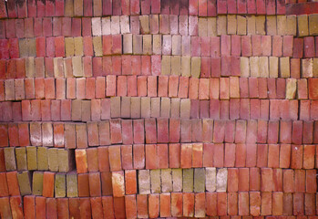 stacked red bricks textured background with vignette