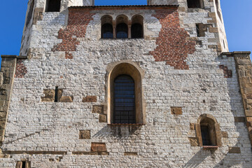 Facade, close-up of a medieval wall with windows of the Catholic Church in Old Krakow on a sunny day