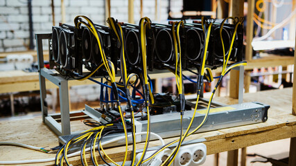 Cryptocurrency mining rig using six high-end graphic cards to mine for bitcoin or ethereum and...
