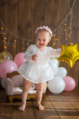 Fototapeta premium Girl's birthday. One year old child. Cake crash. Decor for a child's birthday 