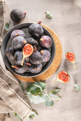 Delicious figs in a plate. Kitchen countertop with some ready-to-eat figs. Space for text