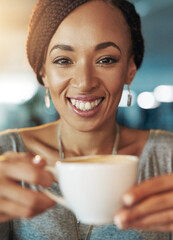 Coffee keeps me going. Cropped portrait of a young woman drinking coffee while working late in her office.