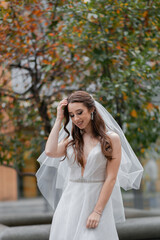 Charming young bride with a veil.