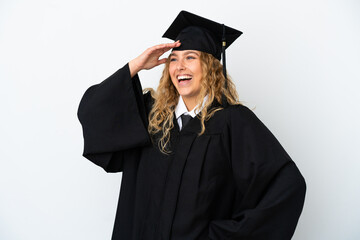 Young university graduate isolated on white background smiling a lot