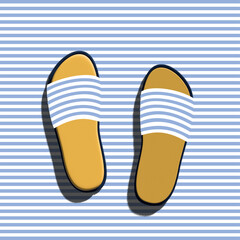 Female blue and white slippers on striped background.