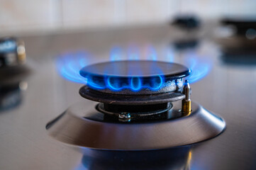 Gas stove on, gas supply and energy dependence.
