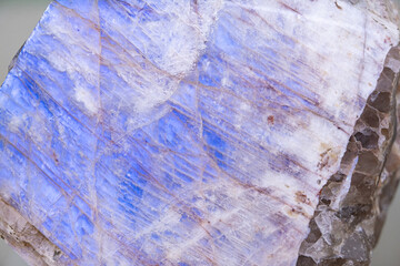 Mineral Oligoclase. or Belomorit. Background, texture. Selective focus. Beautiful abstract blue pattern. Soft focus