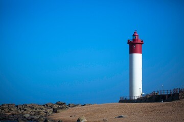 Famous red and white lighthouse and blue sky in the evening Umhlanga near Durban South Africa