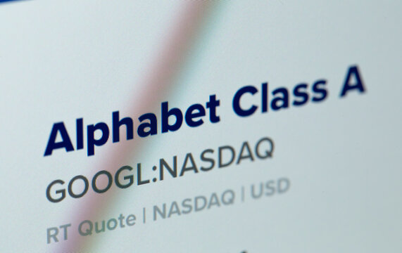 Google stocks, stock ticker (Alphabet Class A) on display notebook closeup. Batumi, Georgia - March 4, 2022