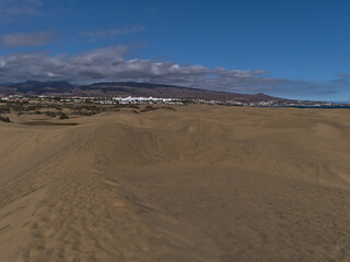 View of popular natural reserve Dunas de Maspalomas in the south of island Gran Canaria, Canary Islands, Spain on the Atlantic coast with sand dunes.