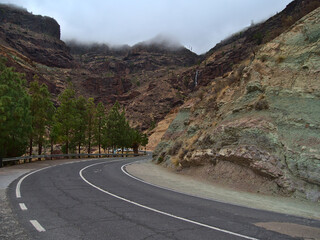 View of the colorful volcanic rocks Los Azulejos De Veneguera in the western mountains of island Gran Canaria, Canary Islands, Spain on cloudy day.