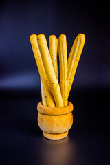 Breadsticks on dark background