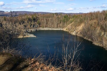 Vykleky. View of an old flooded quarry in early spring. Central Moravia. Europe.
