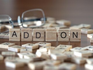add on word or concept represented by wooden letter tiles on a wooden table with glasses and a book - obrazy, fototapety, plakaty