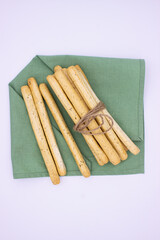 Breadsticks on light background