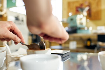 bartender pouring beer into glass