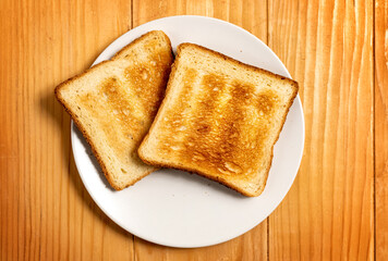 Two Slices of Toast Bread on a Wooden Table Setup