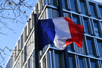 French flag on modern building background
