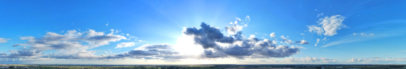 Impressive panoramic shot of the horizon with a great blue sky with clouds